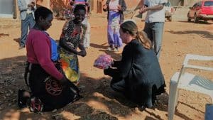 A CDF Canada volunteer interacting with people.